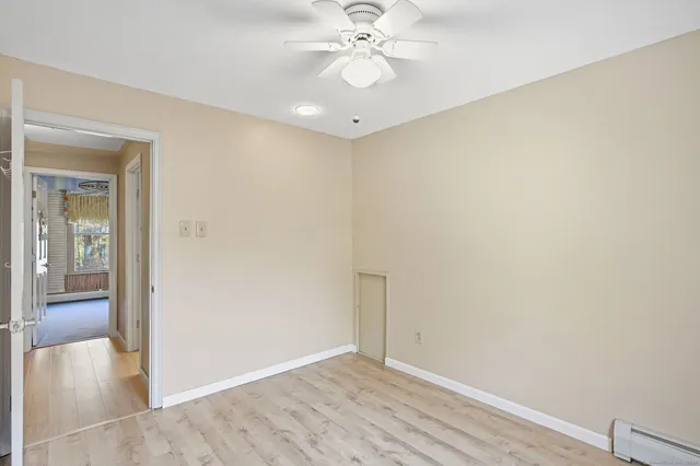 a view of an empty room and a window