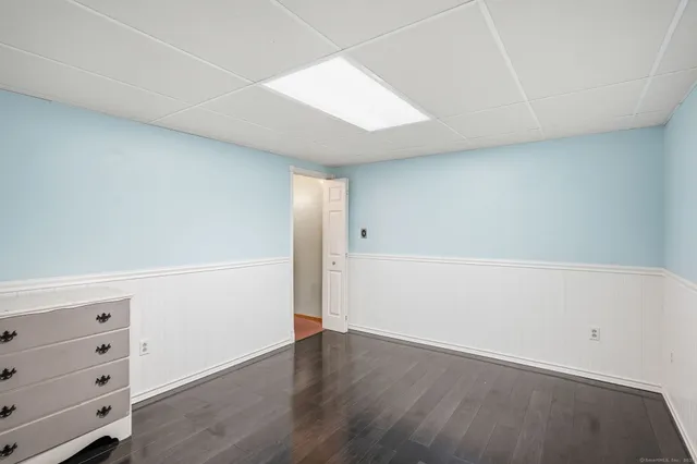 an empty room with wooden floor