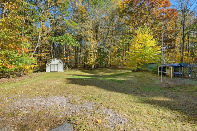 a view of swimming pool from a yard
