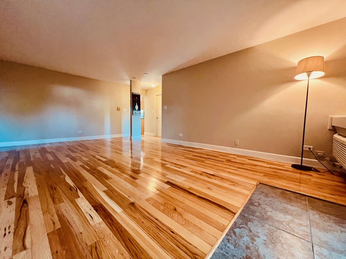 2219 Nichols Road, Unit 17A Arlington Heights, IL 60004 - Photo 4 of 19 a view of a room with wooden floor