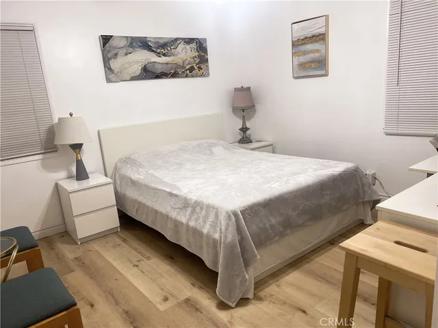 a bedroom with a bed and a desk