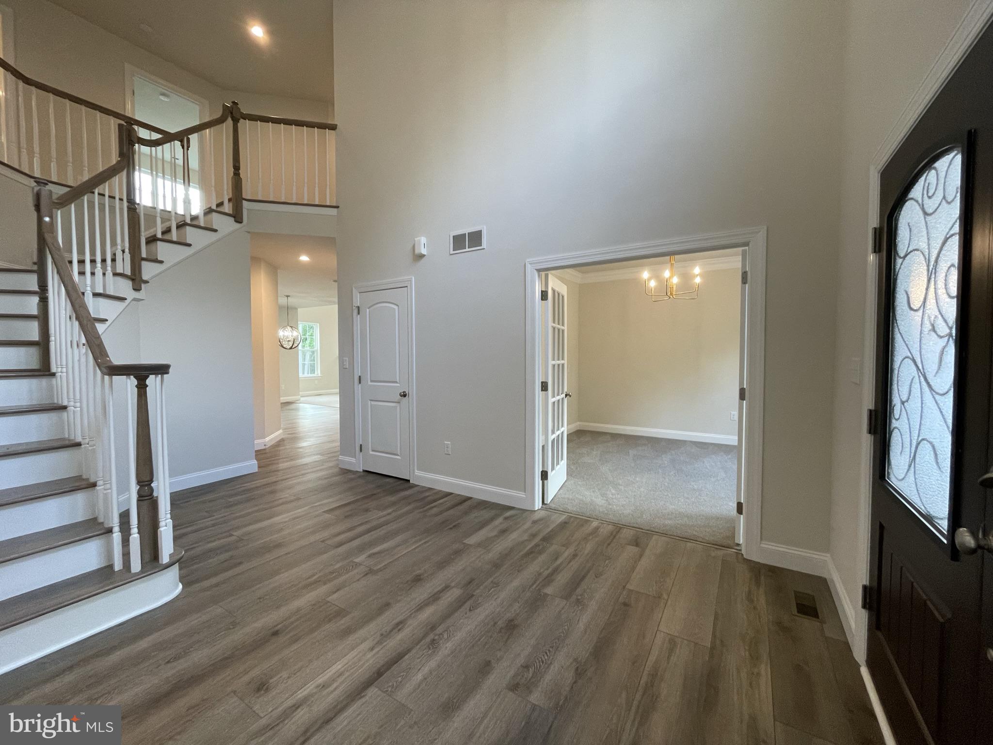 689 Cheyney Road Glen Mills, PA 19319 - Photo 3 of 11 a view of empty room with wooden floor and fan