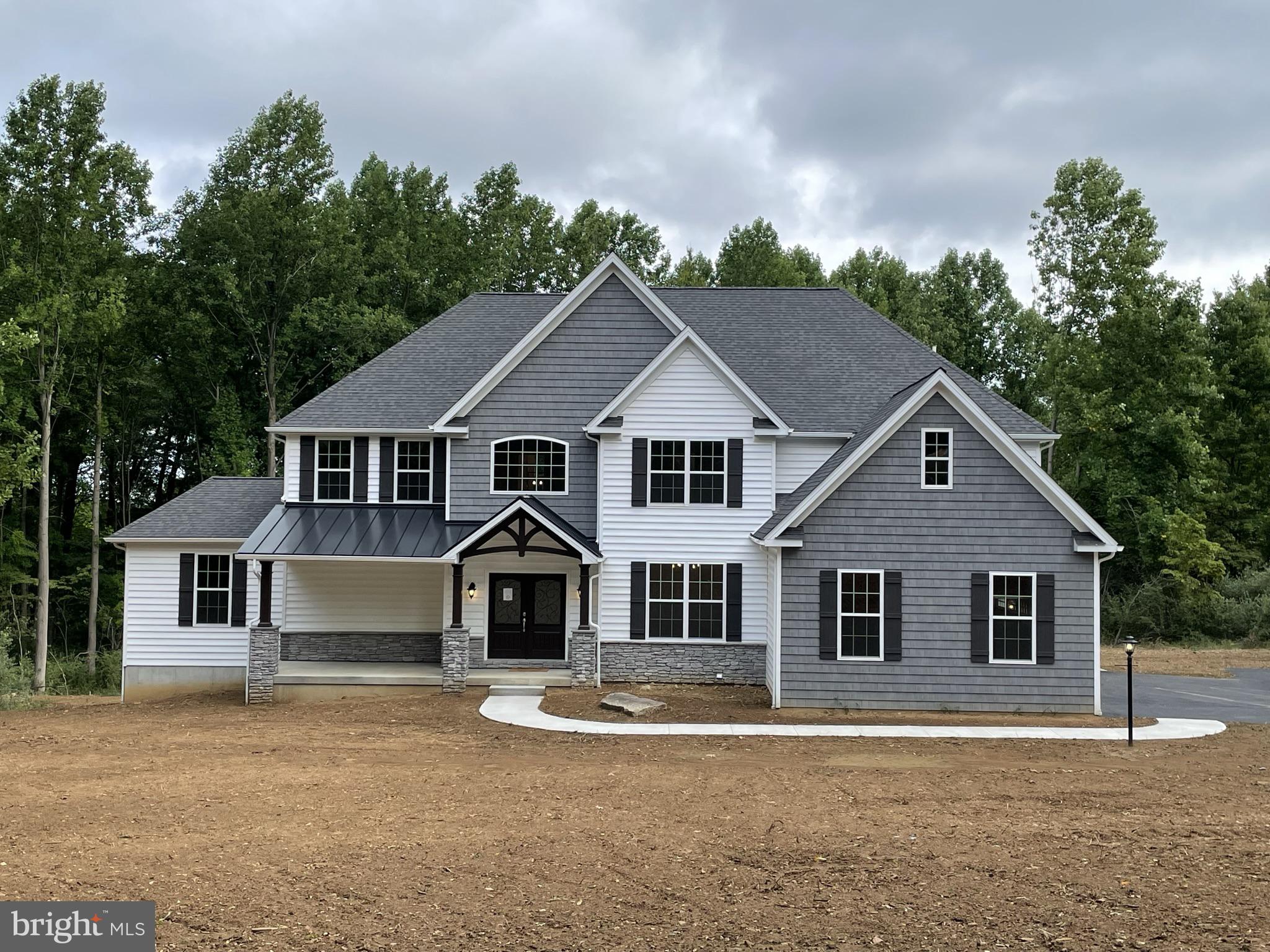689 Cheyney Road Glen Mills, PA 19319 - Photo 10 of 11 a front view of a house with a yard