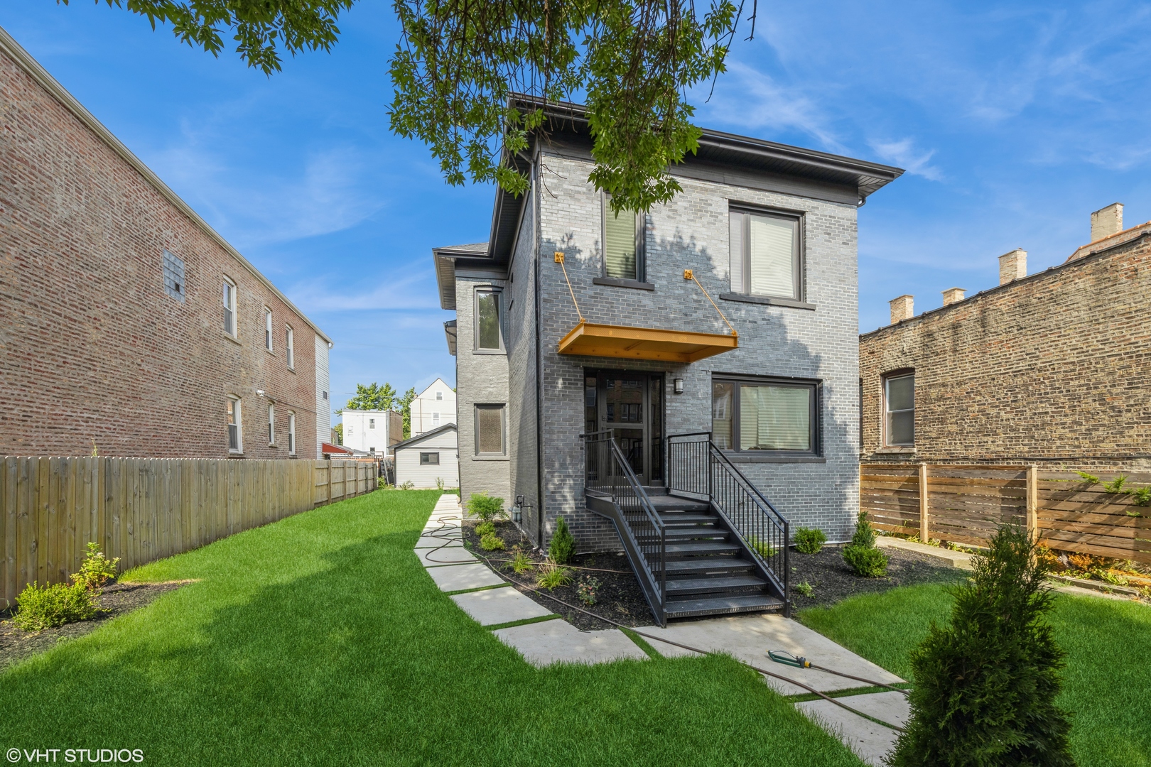 2230 South Ridgeway Avenue Chicago, IL 60623 - Photo 1 of 13 a front view of a house with garden