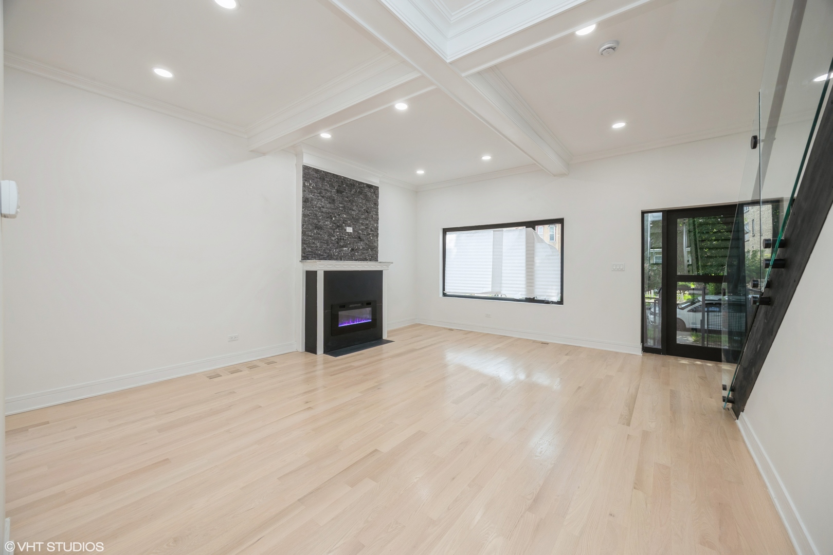 2230 South Ridgeway Avenue Chicago, IL 60623 - Photo 3 of 13 an empty room with windows and fireplace