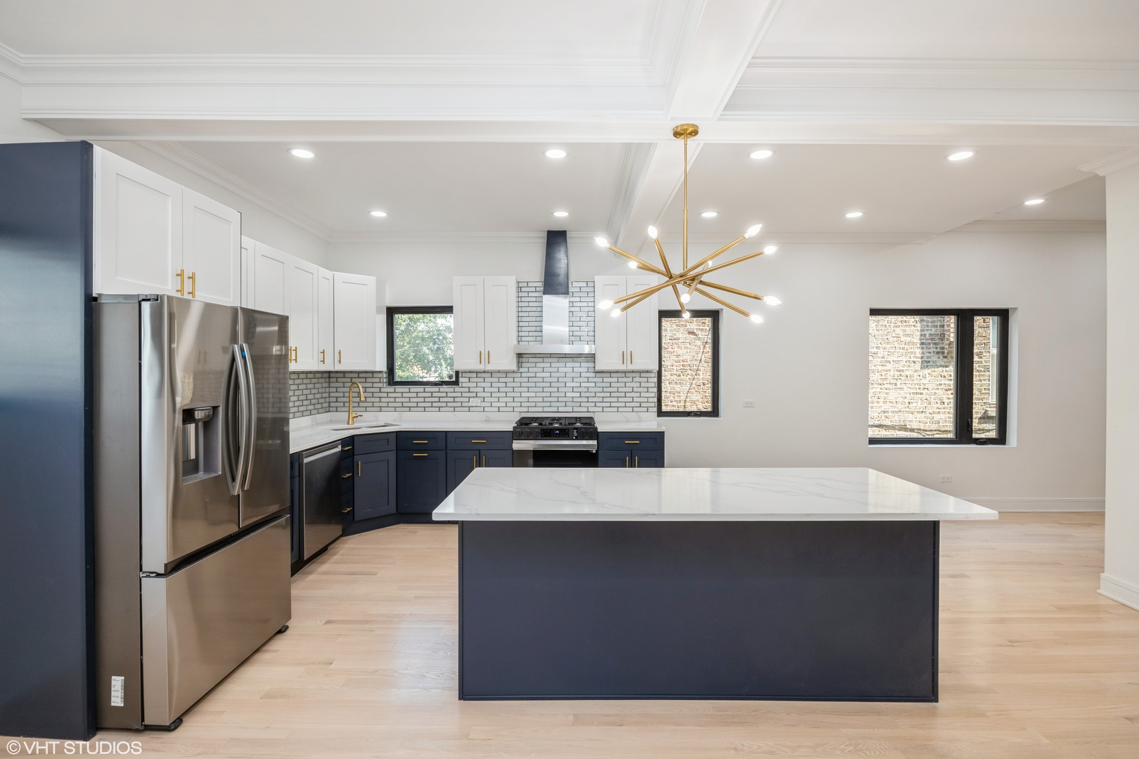 2230 South Ridgeway Avenue Chicago, IL 60623 - Photo 5 of 13 a large kitchen with a large counter top stainless steel appliances and cabinets