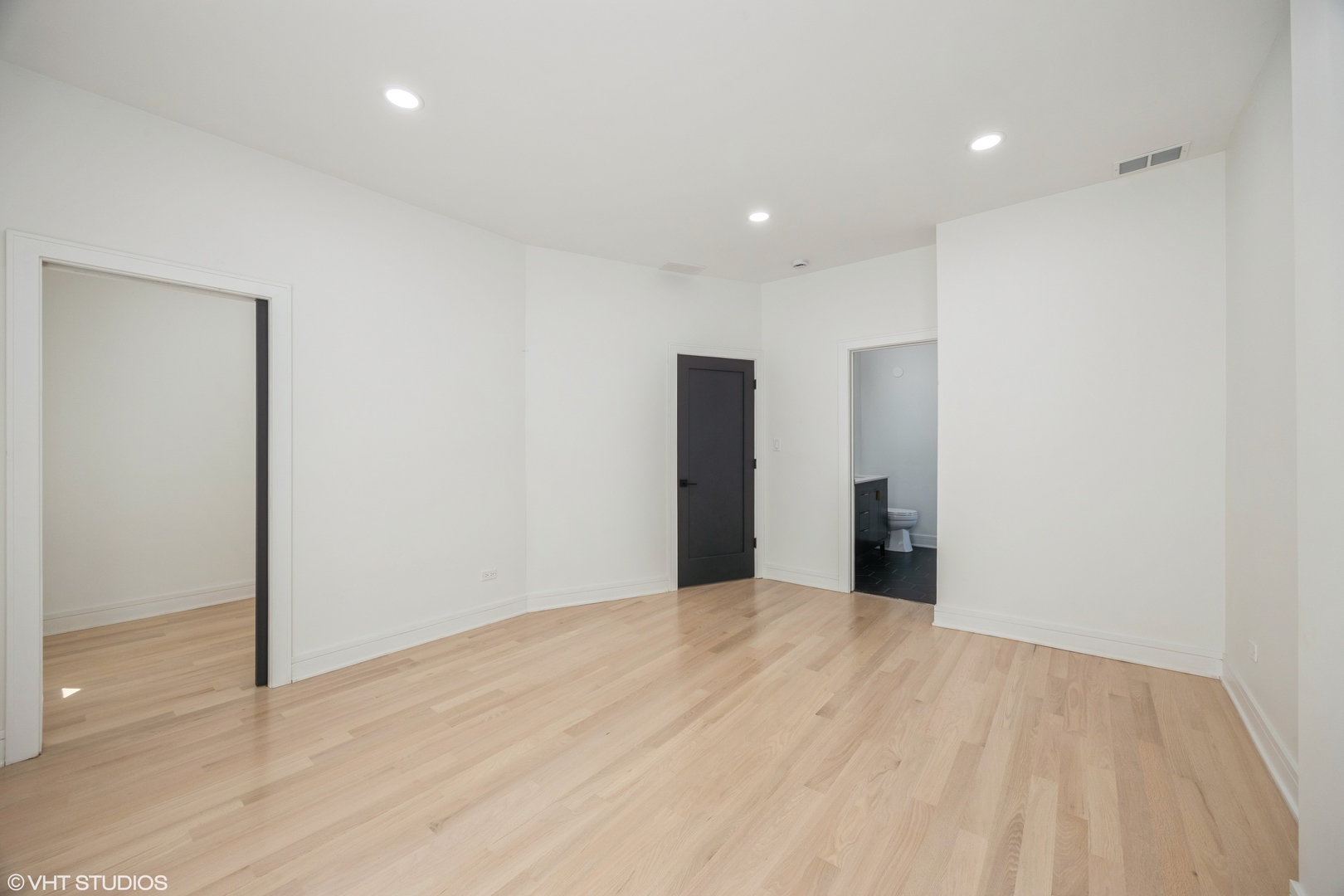 2230 South Ridgeway Avenue Chicago, IL 60623 - Photo 7 of 13 a view of an empty room with wooden floor