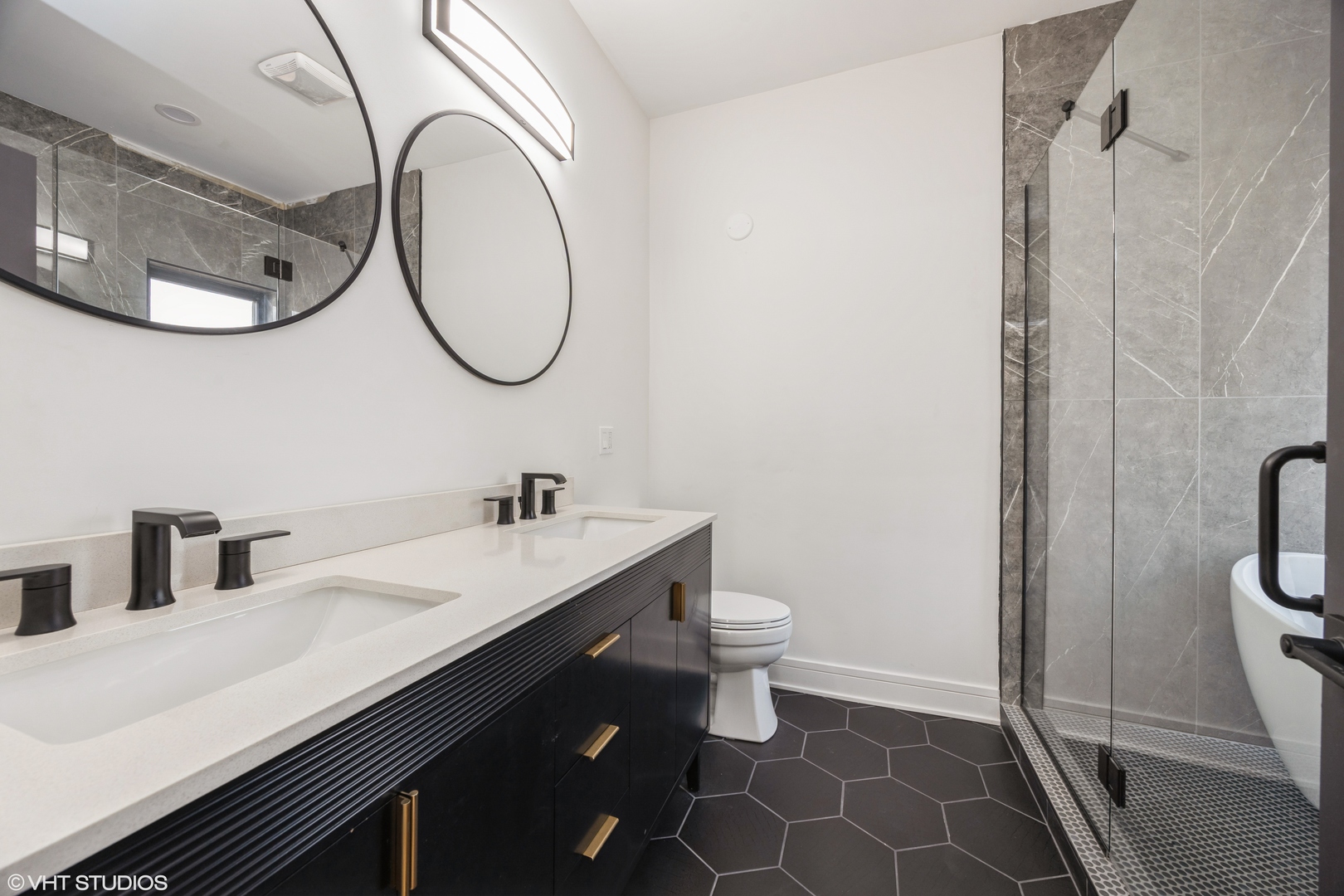 2230 South Ridgeway Avenue Chicago, IL 60623 - Photo 10 of 13 a bathroom with a sink a toilet and a mirror