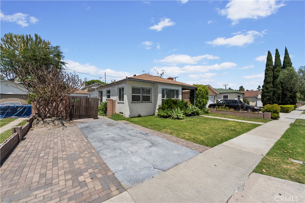 2725 East Tyler Street Carson, CA 90810 - Photo 25 of 30 a view of house with yard and green space