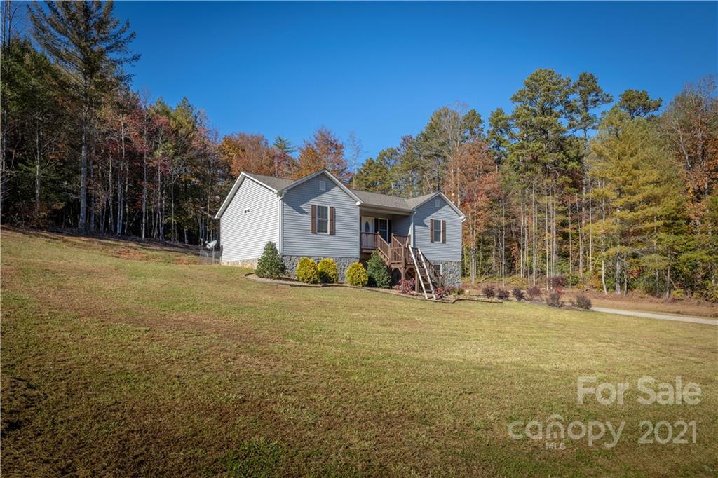 3604 Deerbrook Road Lenoir, NC 28645 - Photo 2 of 21 a view of a house with backyard and trees