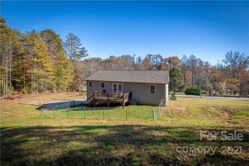 3604 Deerbrook Road Lenoir, NC 28645 - Photo 3 of 21 a backyard of a house with table and chairs