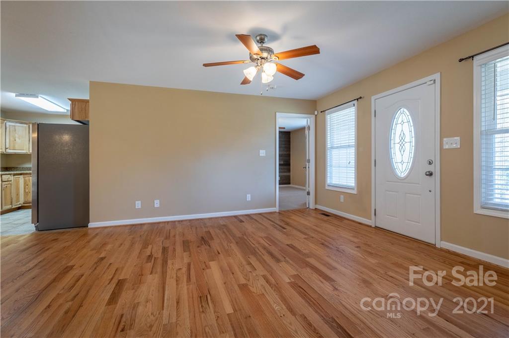 3604 Deerbrook Road Lenoir, NC 28645 - Photo 5 of 21 a view of an empty room with window and wooden floor