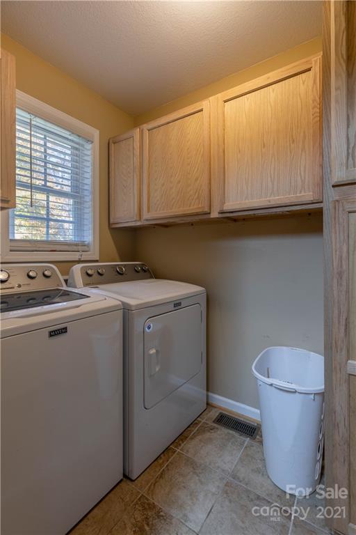 3604 Deerbrook Road Lenoir, NC 28645 - Photo 8 of 21 a utility room with a sink a toilet and a window