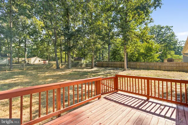 a view of balcony with wooden floor