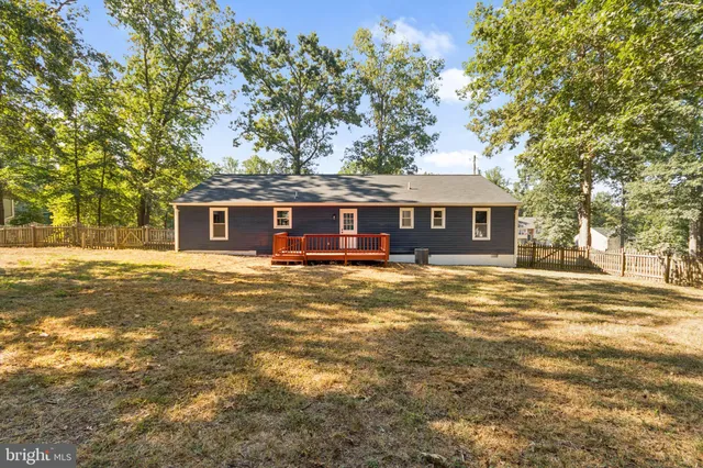 a front view of a house with a big yard