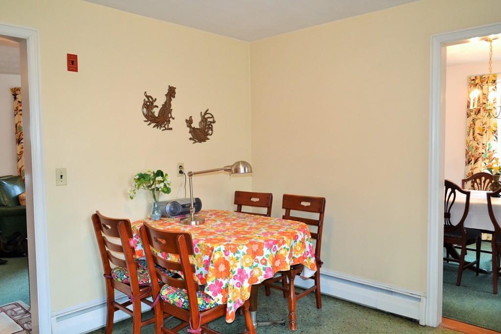 10 Crestline Circle Beverly, MA 01915 - Photo 11 of 22 a bedroom with a bed and a table in it