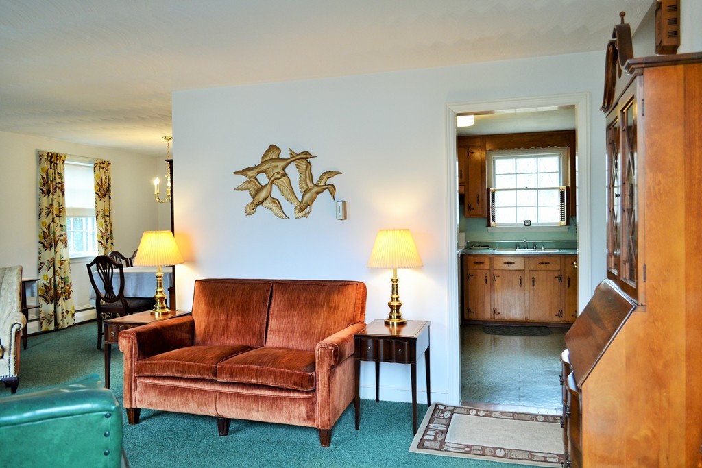 10 Crestline Circle Beverly, MA 01915 - Photo 2 of 22 a living room with furniture and a fireplace
