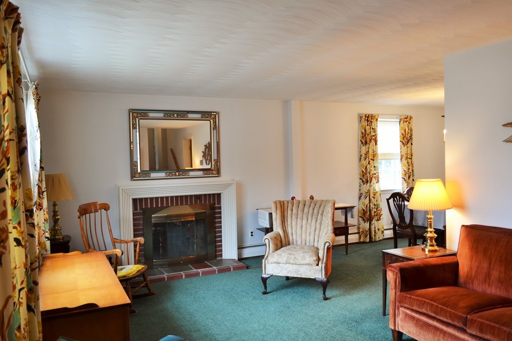 10 Crestline Circle Beverly, MA 01915 - Photo 3 of 22 a living room with furniture and a fireplace