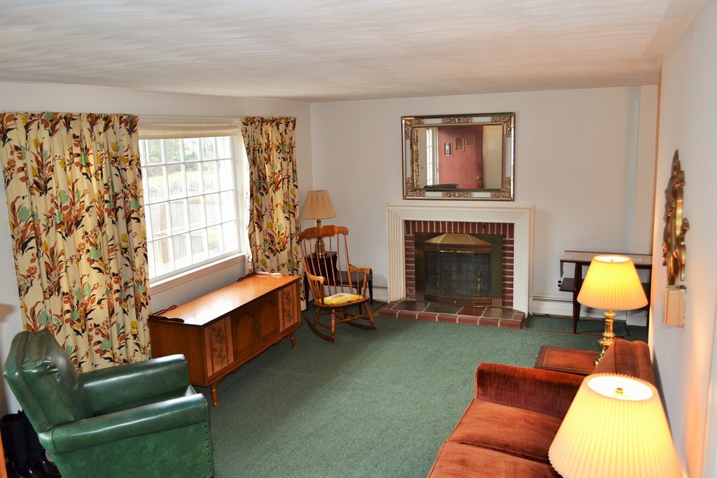 10 Crestline Circle Beverly, MA 01915 - Photo 4 of 22 a living room with furniture and a fireplace