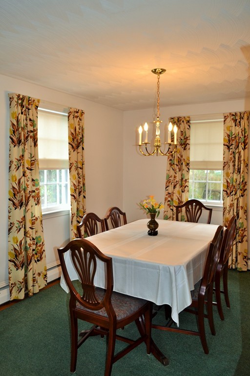 10 Crestline Circle Beverly, MA 01915 - Photo 6 of 22 a view of a dining room with furniture and chandelier