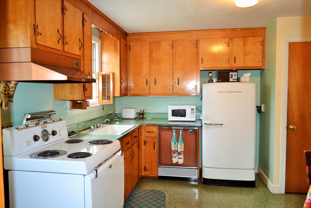 10 Crestline Circle Beverly, MA 01915 - Photo 10 of 22 a kitchen with a stove a sink and a refrigerator