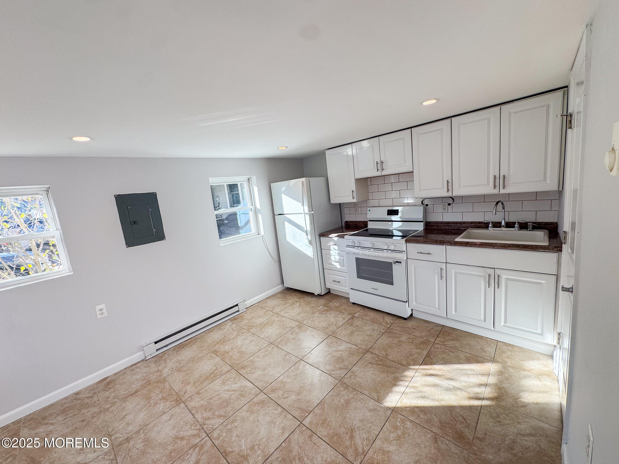 4 Via Ripa, Unit 3 Sea Bright, NJ 07760 - Photo 2 of 14 a kitchen with stainless steel appliances granite countertop a stove a sink and a refrigerator