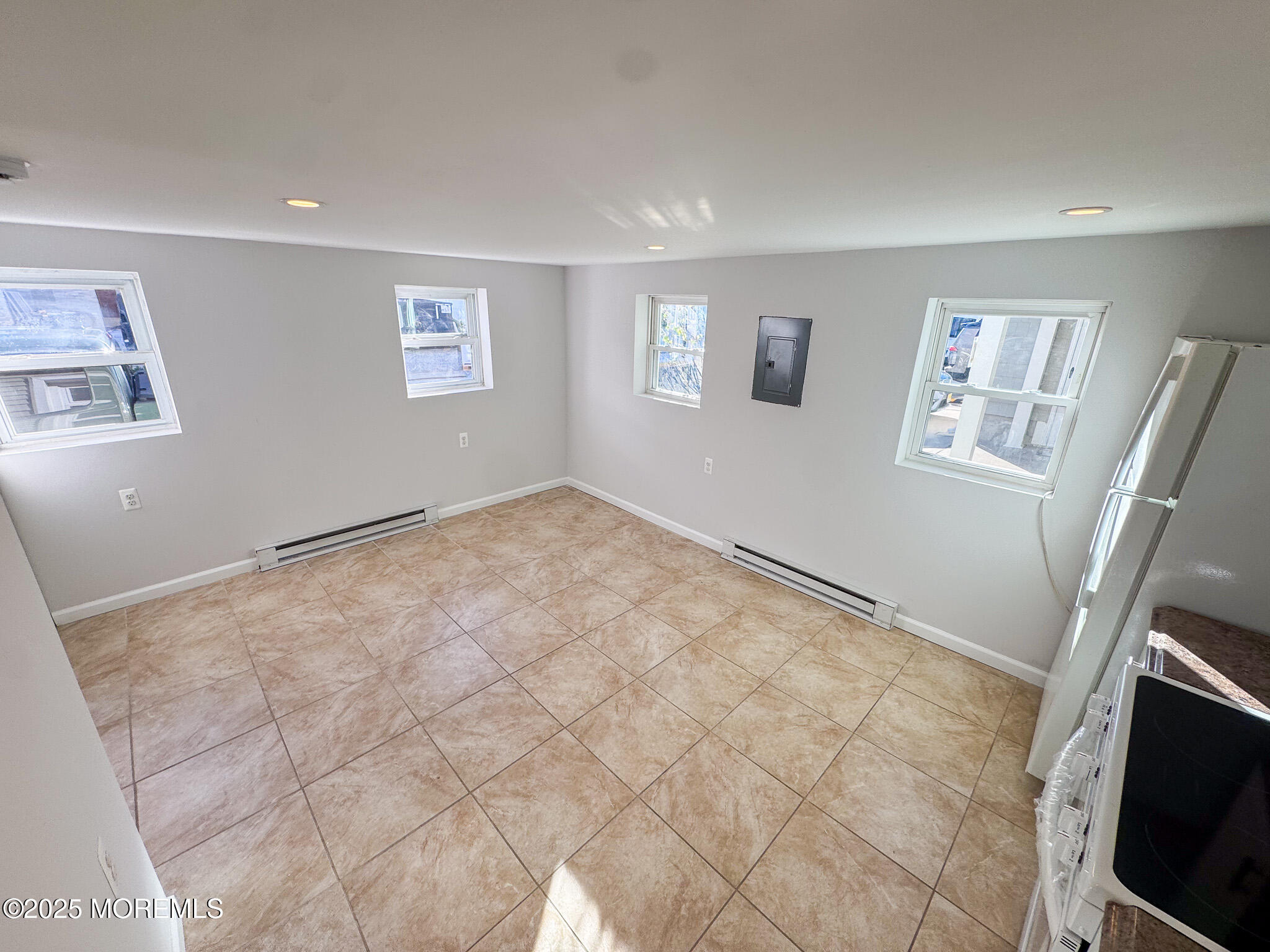 4 Via Ripa, Unit 3 Sea Bright, NJ 07760 - Photo 5 of 14 a view of a livingroom with wooden floor and a flat screen tv