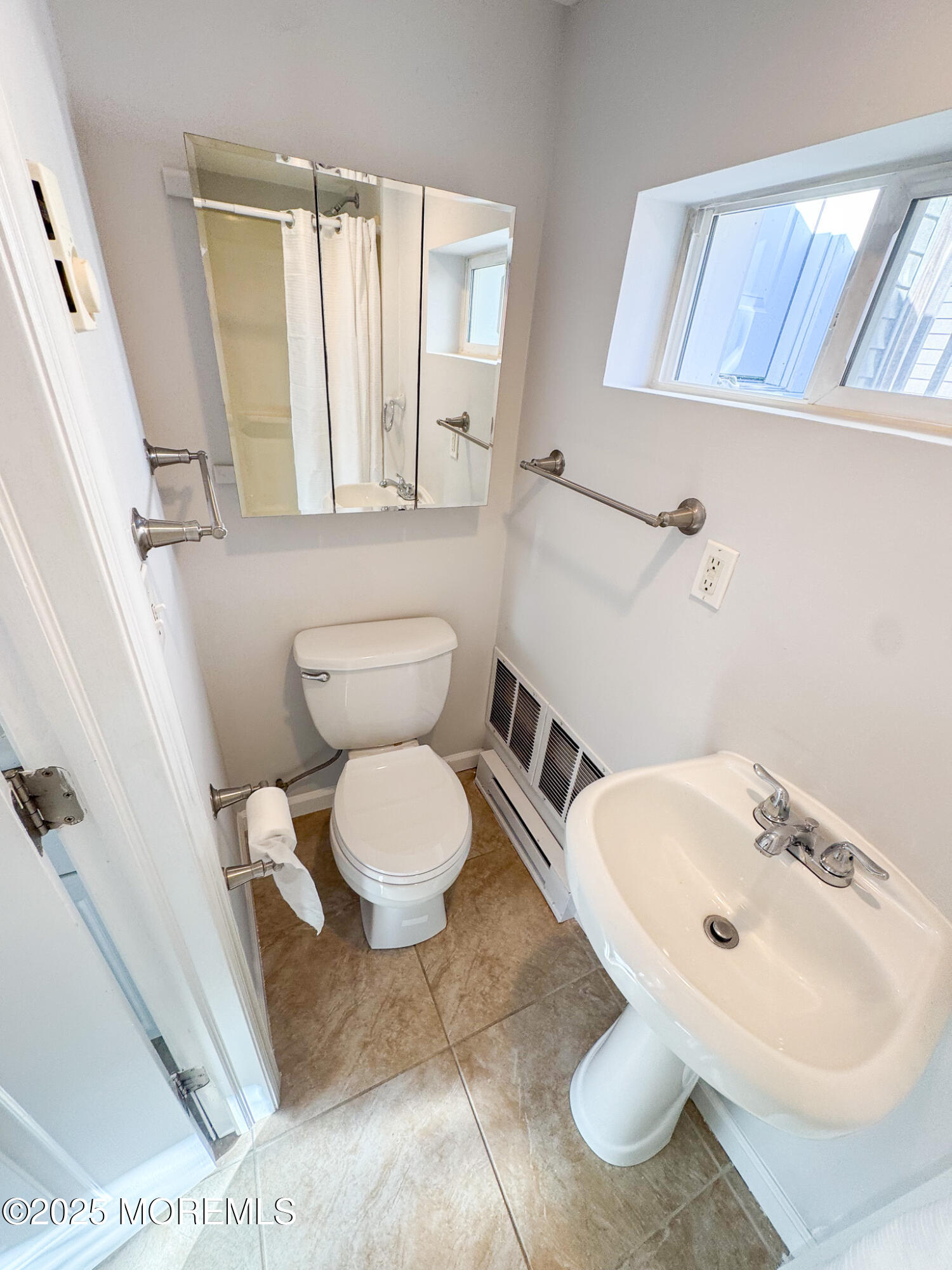 4 Via Ripa, Unit 3 Sea Bright, NJ 07760 - Photo 8 of 14 a bathroom with a sink toilet and mirror