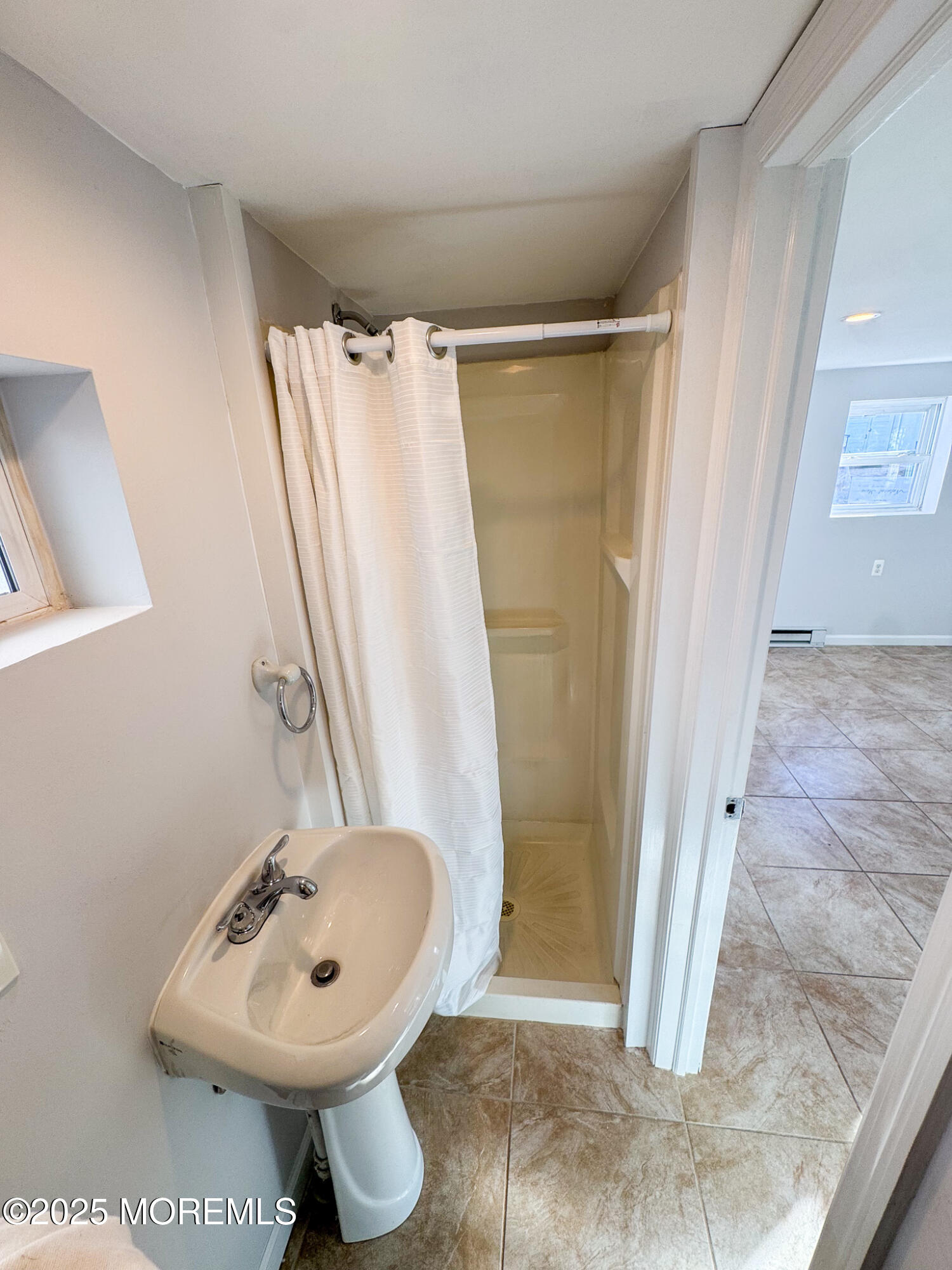 4 Via Ripa, Unit 3 Sea Bright, NJ 07760 - Photo 9 of 14 a bathroom with a sink toilet and shower