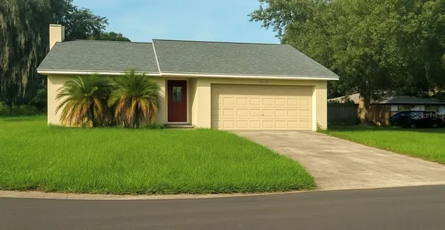 a view of a yard in front view of a house