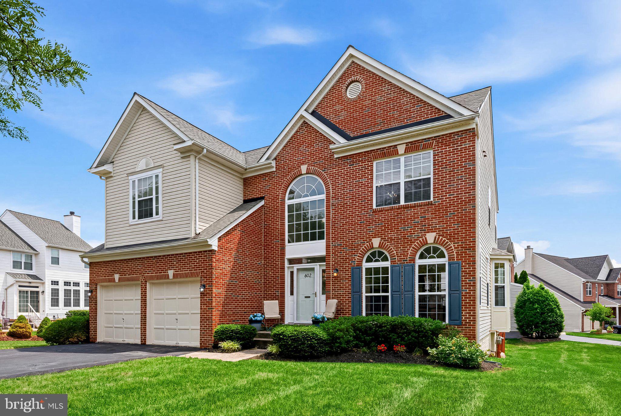 602 Shanks Evans Road Northeast Leesburg, VA 20176 - Photo 42 of 43 Charming brick home with lush greenery.