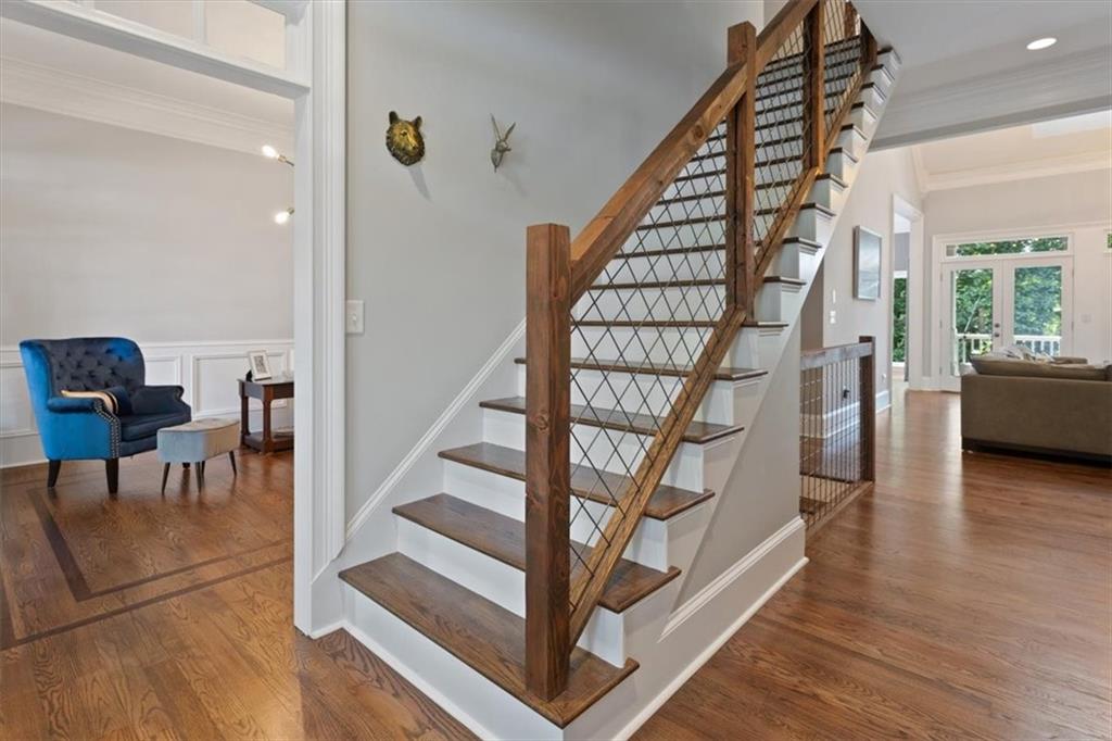 134 Prospector Ridge Dahlonega, GA 30533 - Photo 13 of 96 a view of entryway with wooden floor and stairs