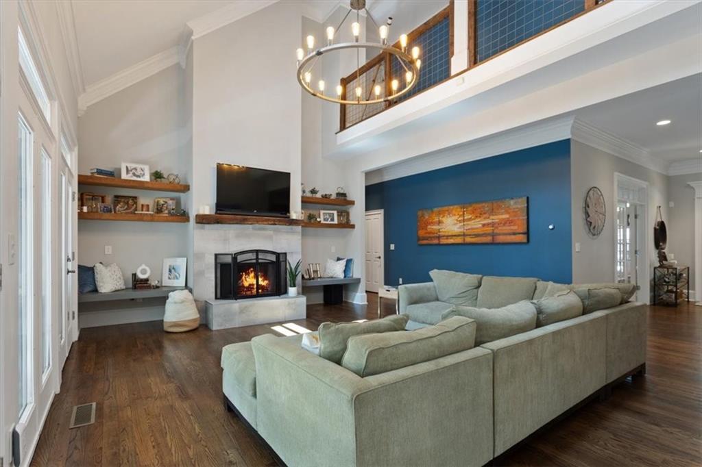 134 Prospector Ridge Dahlonega, GA 30533 - Photo 22 of 96 a living room with furniture a flat screen tv and a fireplace