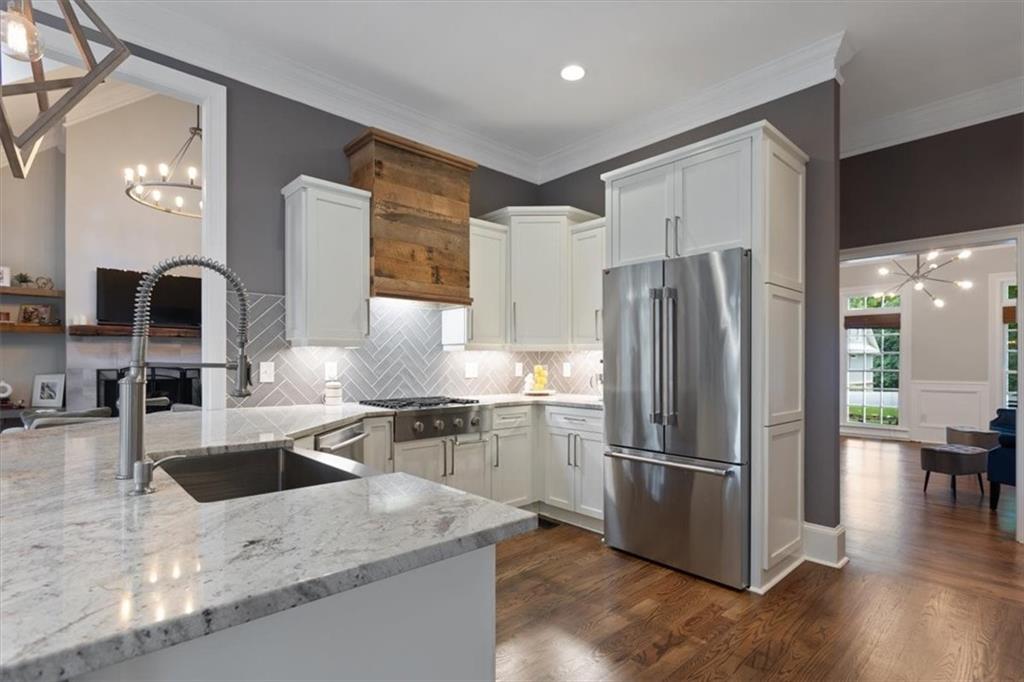 134 Prospector Ridge Dahlonega, GA 30533 - Photo 27 of 96 a kitchen with stainless steel appliances granite countertop a refrigerator and a sink
