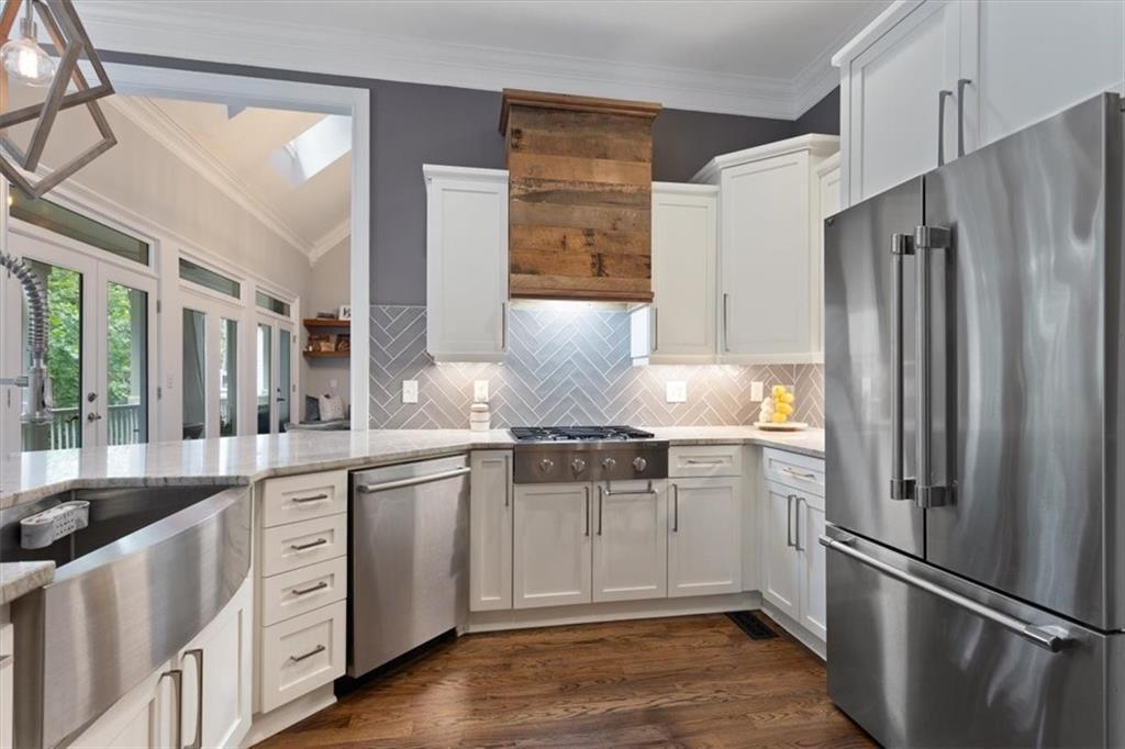 134 Prospector Ridge Dahlonega, GA 30533 - Photo 28 of 96 a kitchen with stainless steel appliances granite countertop a refrigerator and a stove