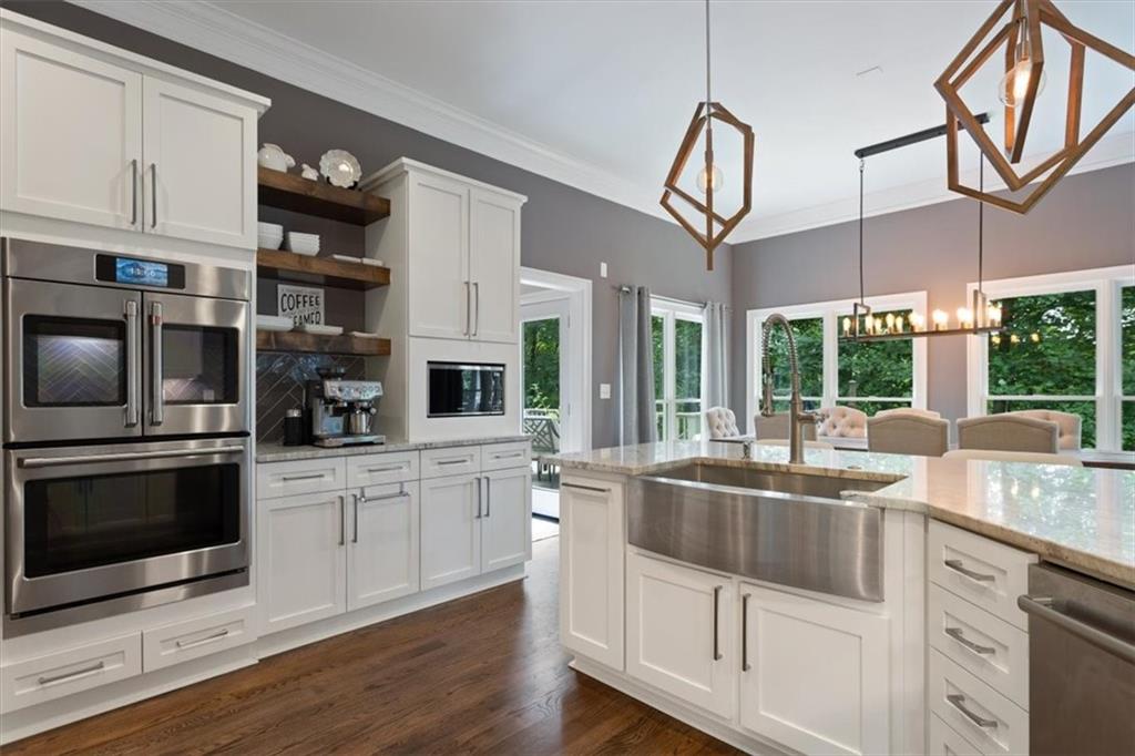 134 Prospector Ridge Dahlonega, GA 30533 - Photo 29 of 96 a kitchen with stainless steel appliances granite countertop a sink and oven