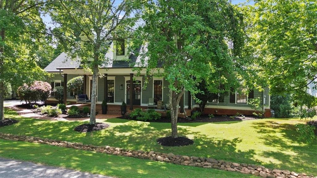 134 Prospector Ridge Dahlonega, GA 30533 - Photo 3 of 96 a view of a house with backyard garden and sitting area