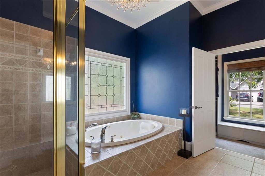 134 Prospector Ridge Dahlonega, GA 30533 - Photo 36 of 96 a bathroom with a tub and a shower