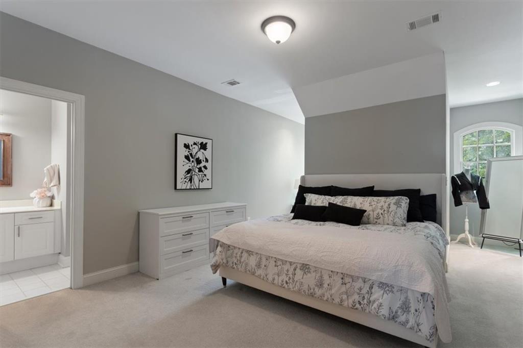 134 Prospector Ridge Dahlonega, GA 30533 - Photo 51 of 96 a bedroom with a bed and a dresser