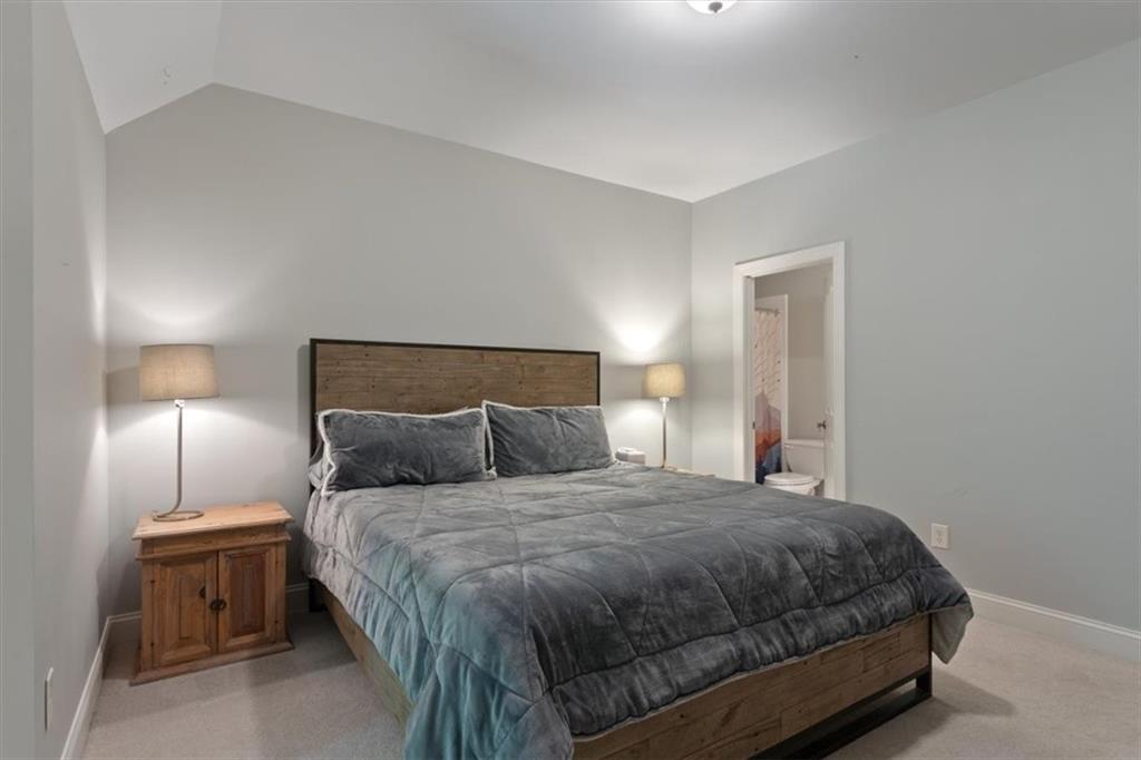 134 Prospector Ridge Dahlonega, GA 30533 - Photo 55 of 96 a bedroom with a bed and a lamp