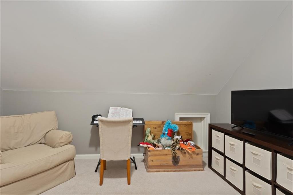 134 Prospector Ridge Dahlonega, GA 30533 - Photo 57 of 96 a living room with furniture and a flat screen tv