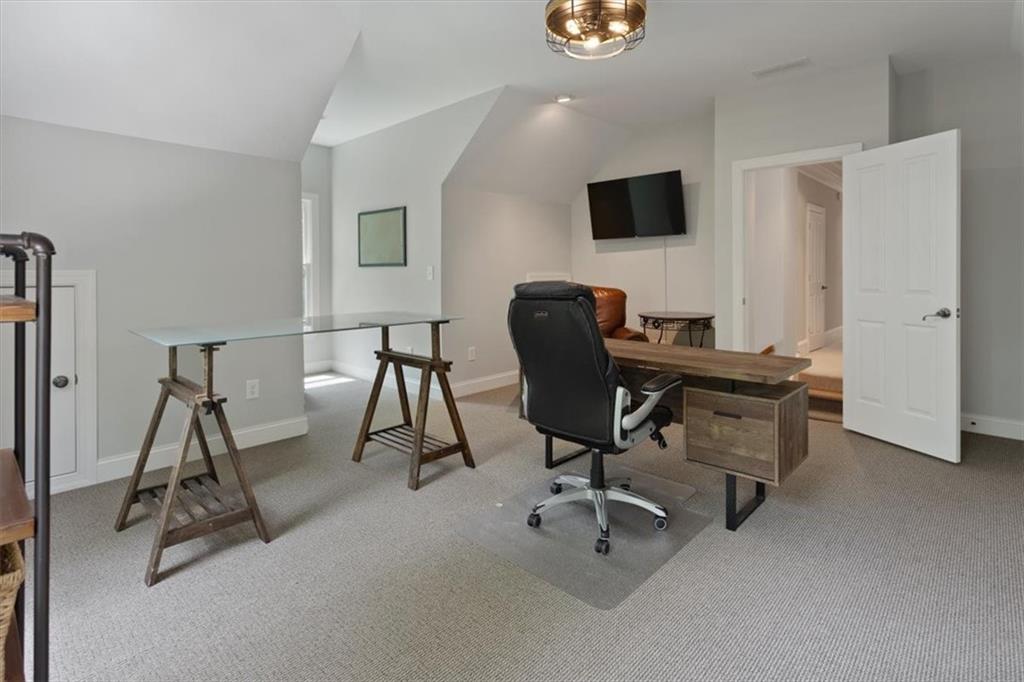 134 Prospector Ridge Dahlonega, GA 30533 - Photo 60 of 96 a view of a workspace with furniture and a flat screen tv