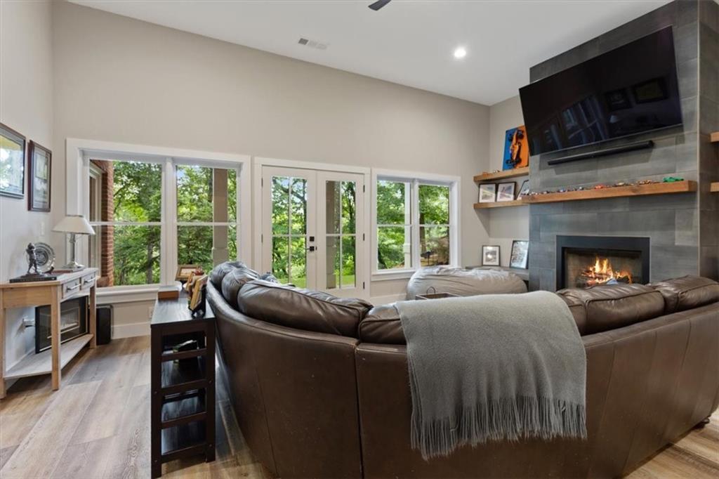 134 Prospector Ridge Dahlonega, GA 30533 - Photo 61 of 96 a living room with furniture a flat screen tv and a fireplace