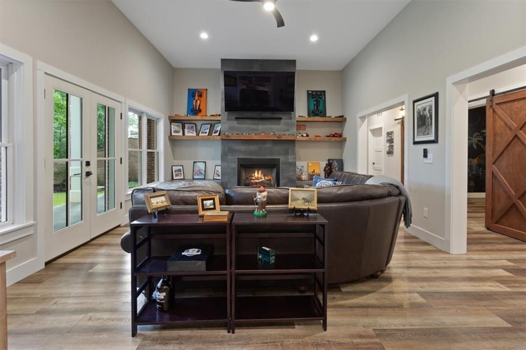 134 Prospector Ridge Dahlonega, GA 30533 - Photo 62 of 96 a living room with fireplace furniture and a flat screen tv