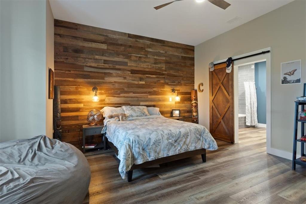 134 Prospector Ridge Dahlonega, GA 30533 - Photo 73 of 96 a bedroom with a bed and a mirror