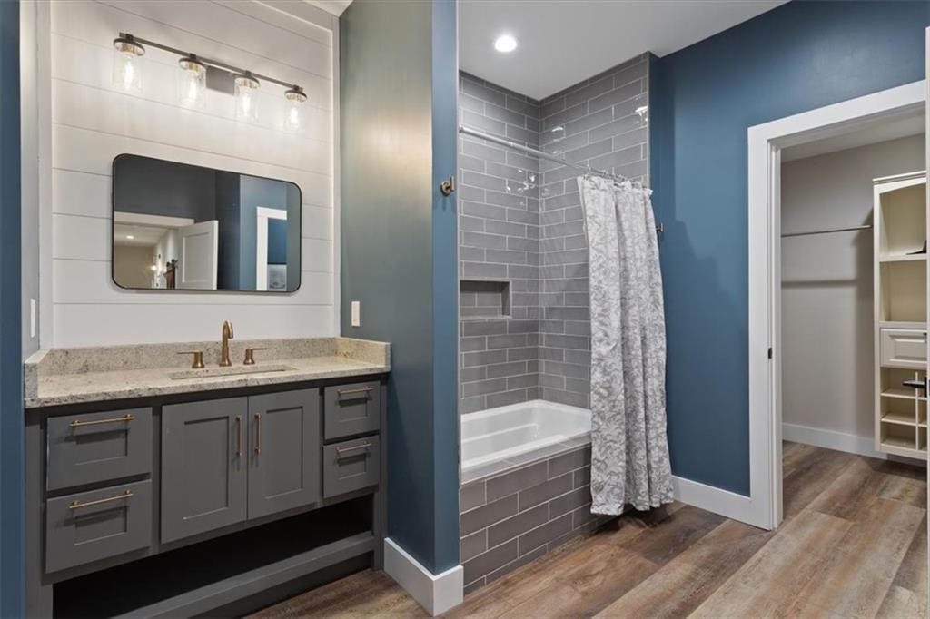 134 Prospector Ridge Dahlonega, GA 30533 - Photo 74 of 96 a bathroom with a granite countertop sink mirror and shower
