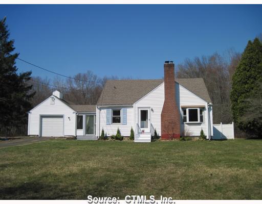 61 Mansfield Hollow Road Mansfield, CT 06250 - Photo 1 of 1 a front view of house with yard and green space