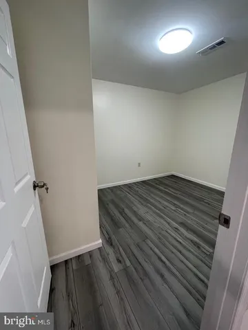 a stove top oven sitting inside of a kitchen