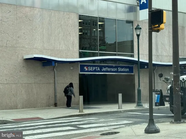 a view of street with shops and buildings