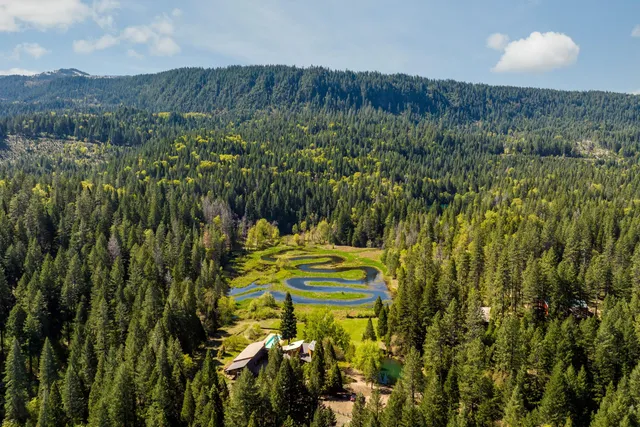 a view of a yard with an outdoor seating